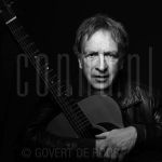 22-06-2006 Alex Roeka at studio in Amsterdam.

[keywords]Black & White Image, Posed, Half Length, Eyecontact, Guitar, Singer[/keywords]